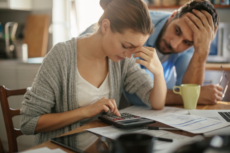 Stressed Couple Working On Budget